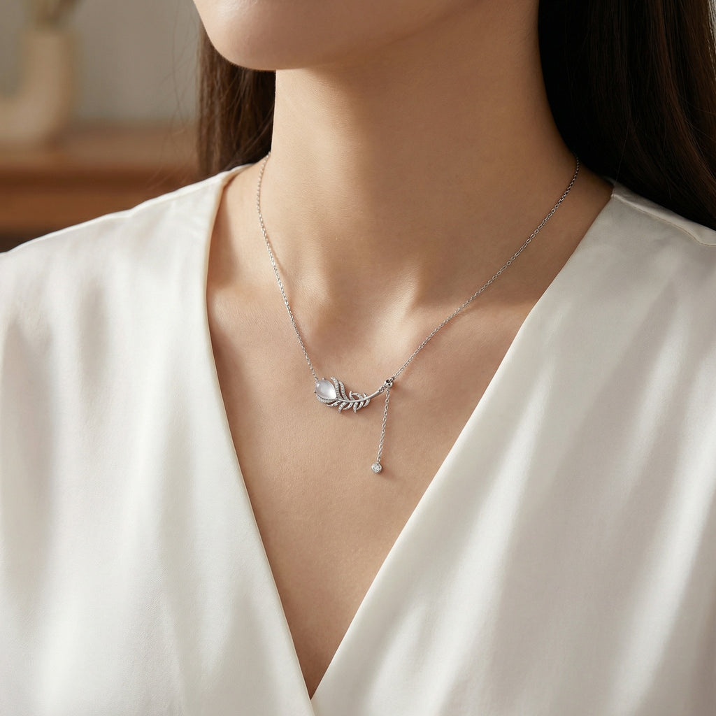 925 Sterling Silver Elegant Sterling Silver Feather Pendant Necklace with Pear Moonstone and Sparkling Accents