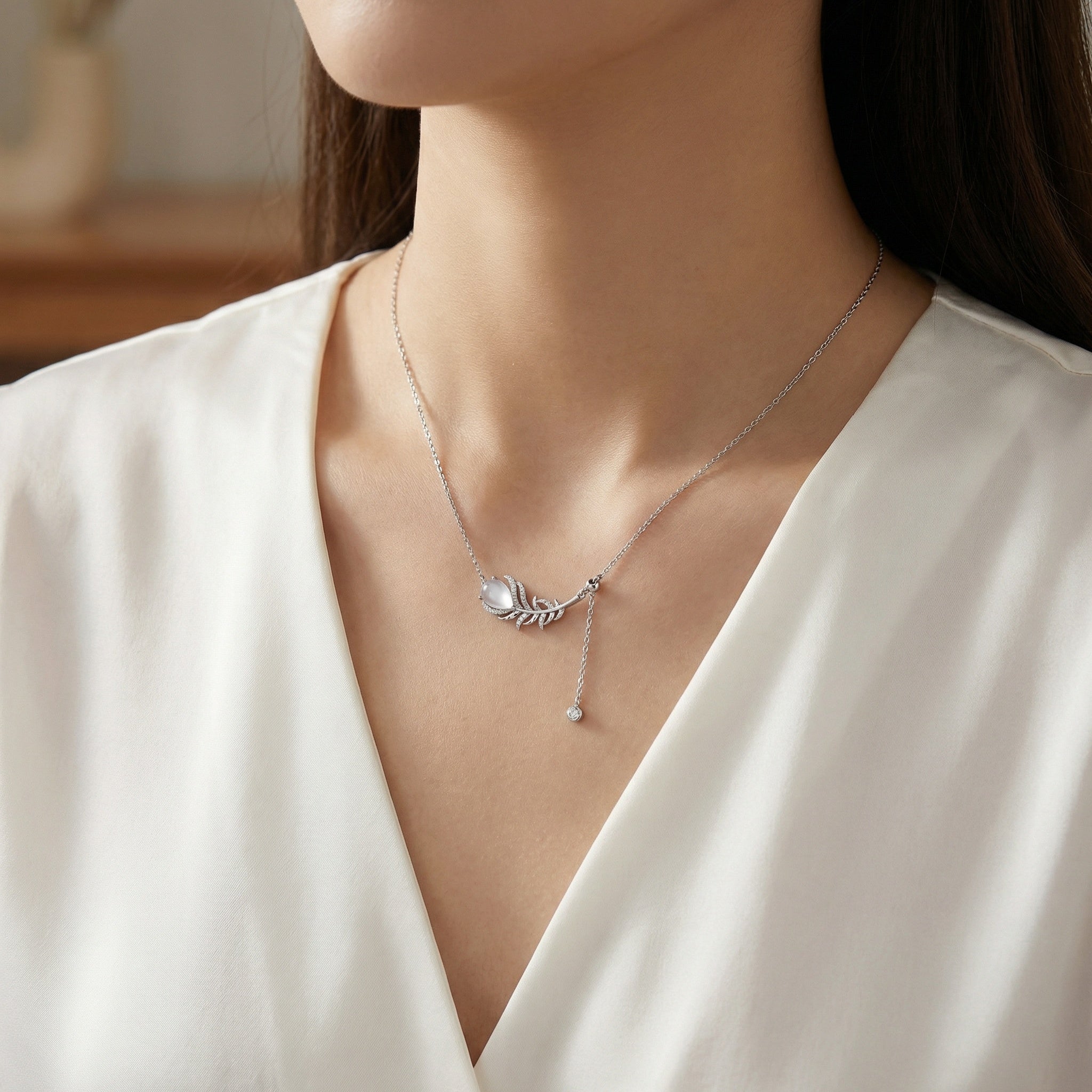 925 Sterling Silver Elegant Sterling Silver Feather Pendant Necklace with Pear Moonstone and Sparkling Accents