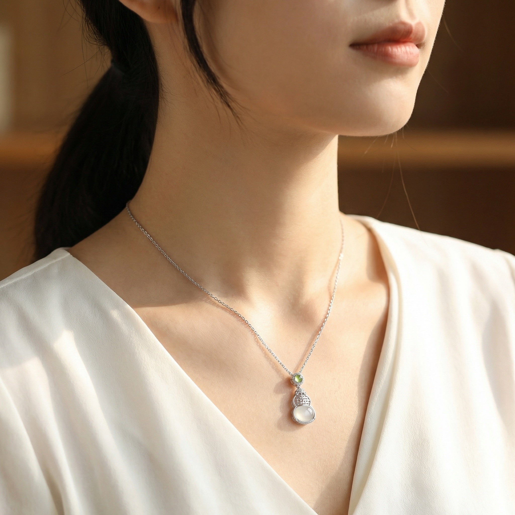 925 Sterling Silver Elegant Hulu Gourd Pendant Necklace Featuring Translucent White and Green Gemstones.